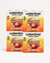 Štyri krabičky Waterdrop Cola Orange s príchuťou koly a pomaranča, umiestnené na bielom pozadí.
