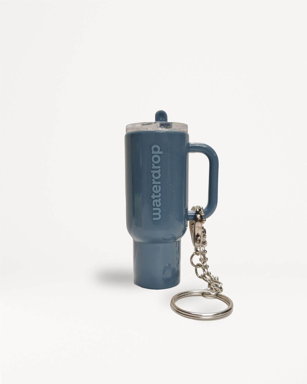 Micro Explorer keychain with lid and key ring attached.